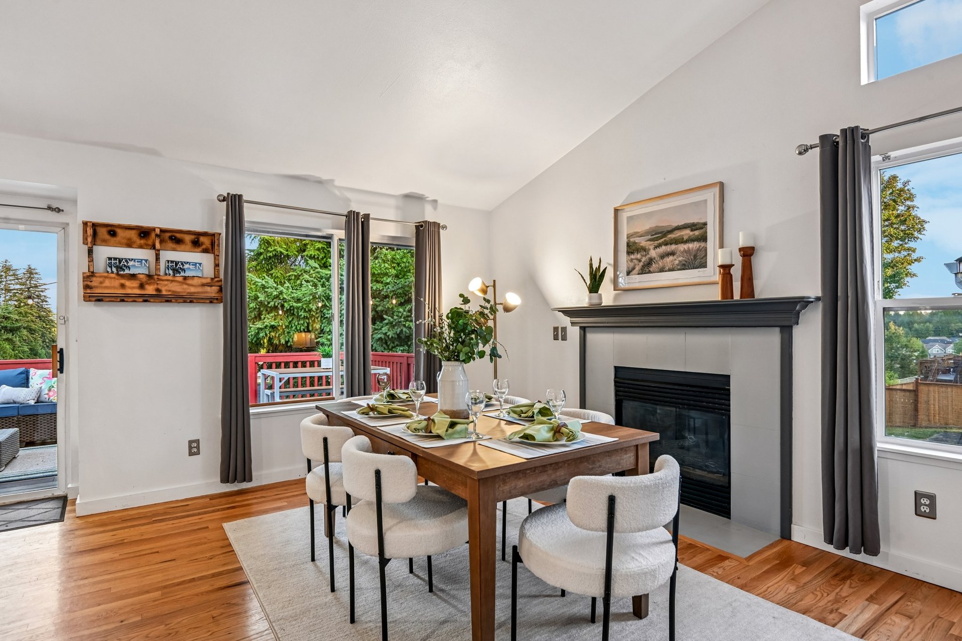 Dining room with a gas fireplace and deck access at 27728 149th Pl SE